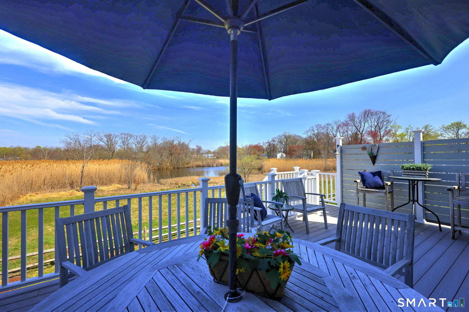 Deck dining with pond views