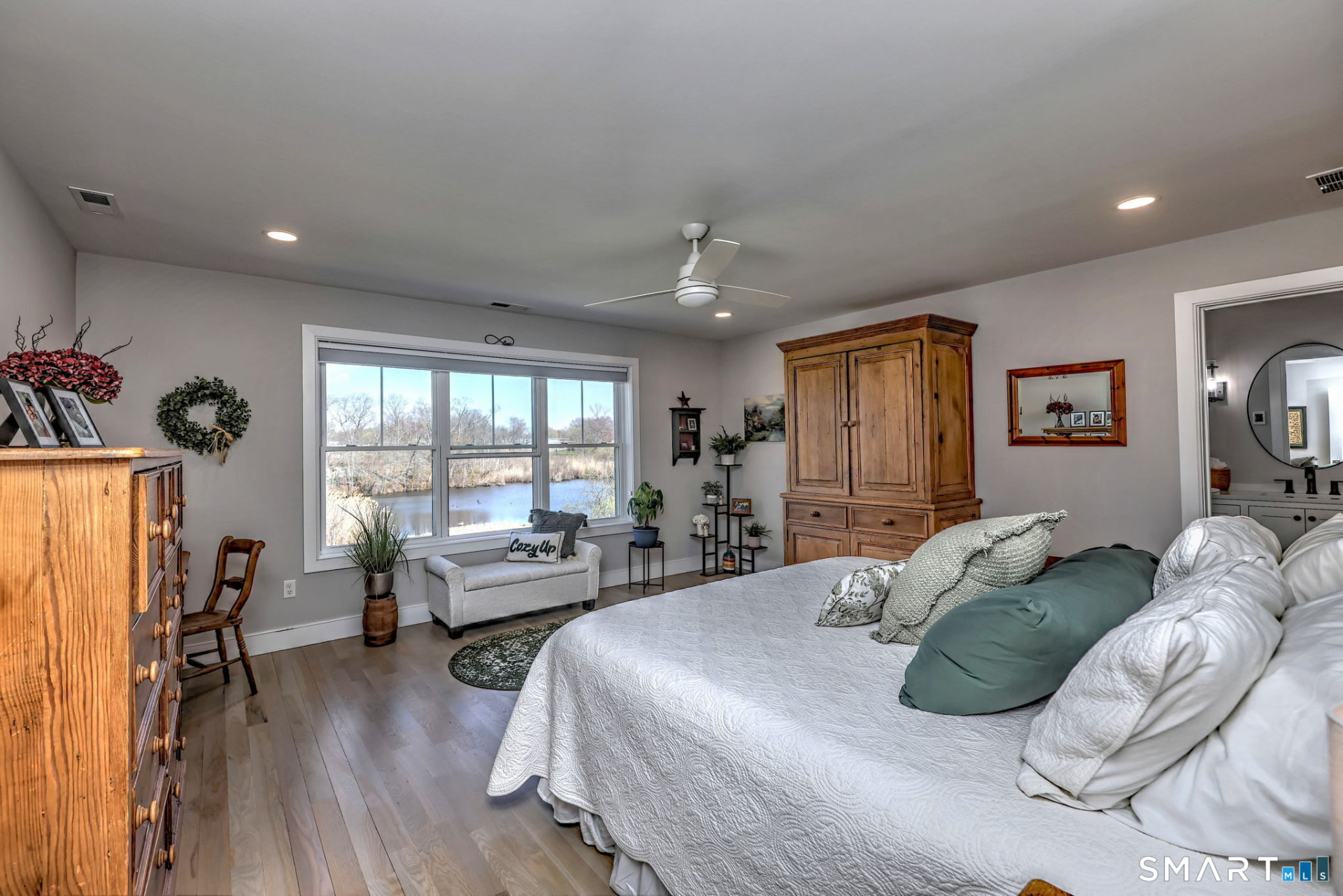 Primary bedroom with pond view